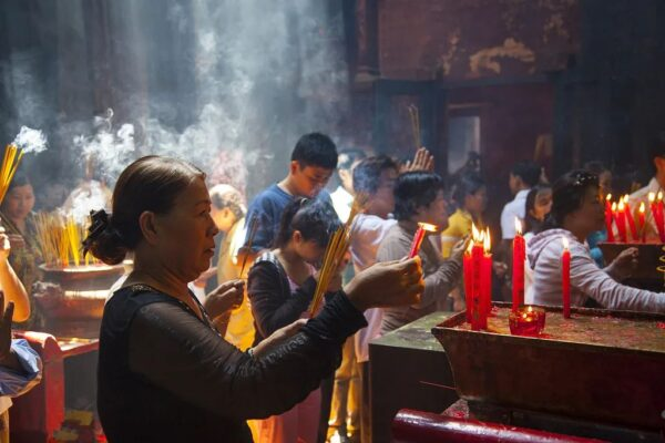 A group of devotees are praying devoutly