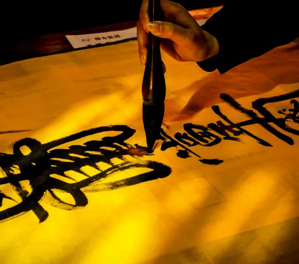 A Taoist priest is drawing talismans.