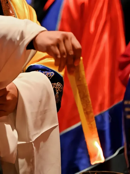 Taoist priests burn talismans